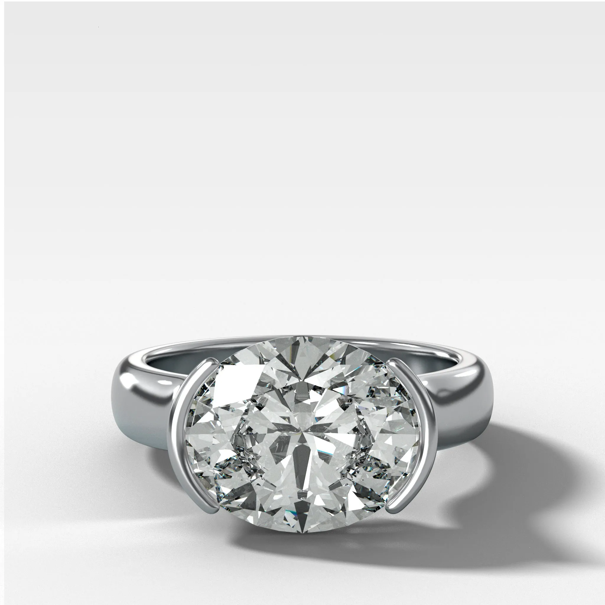 East West Half Bezel 4mm Solitaire Engagement Ring With Oval Cut Diamond
